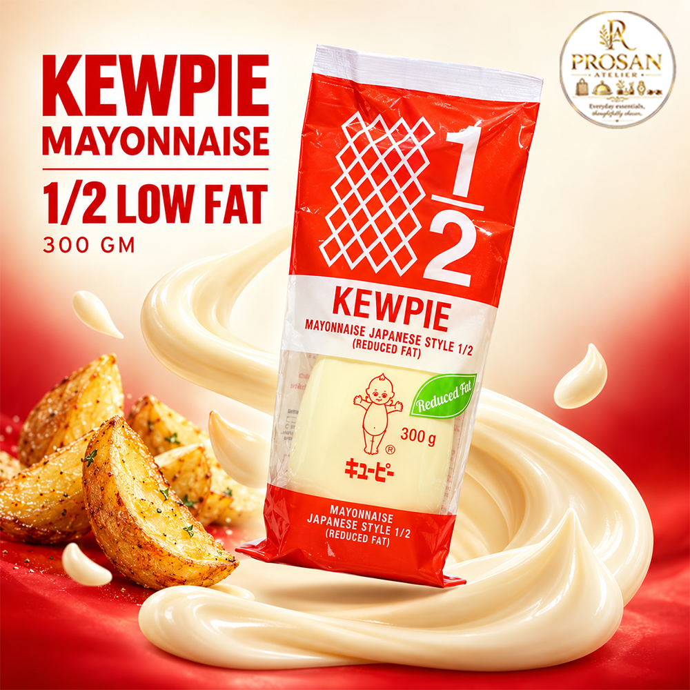 Bottle of Kewpie Mayonnaise 1/2 Low Fat 300g next to a fresh garden salad